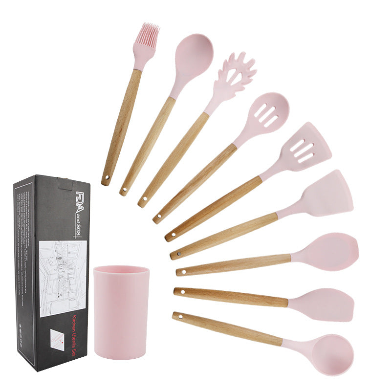 Pink wooden-handled silicone kitchen utensils