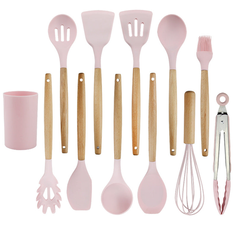 Pink wooden-handled silicone kitchen utensils