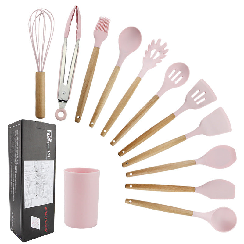 Pink wooden-handled silicone kitchen utensils