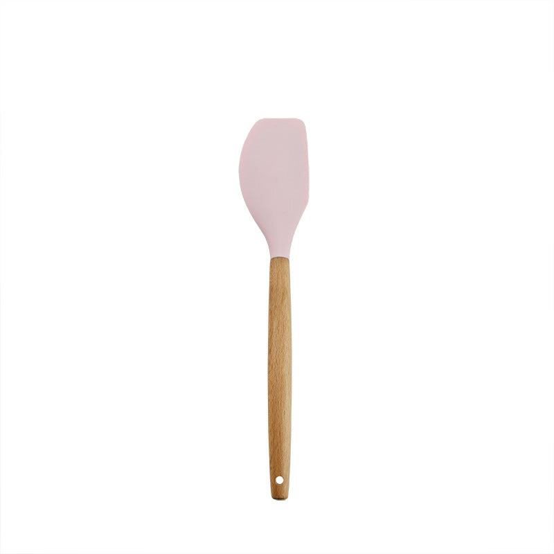 Pink wooden-handled silicone kitchen utensils