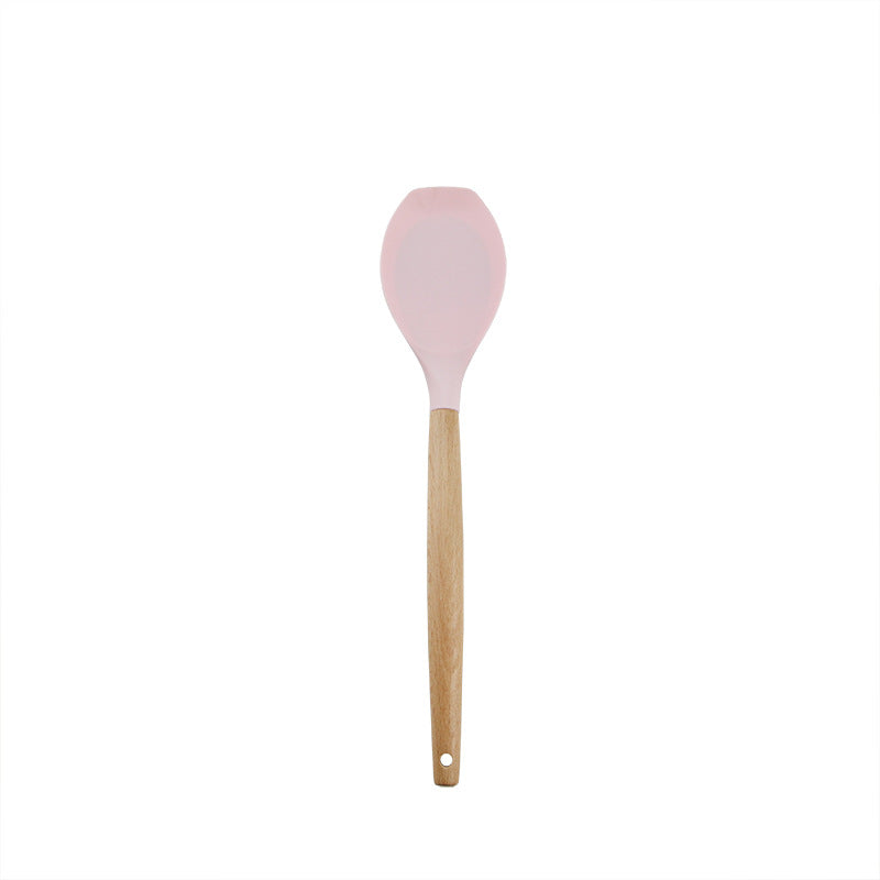 Pink wooden-handled silicone kitchen utensils