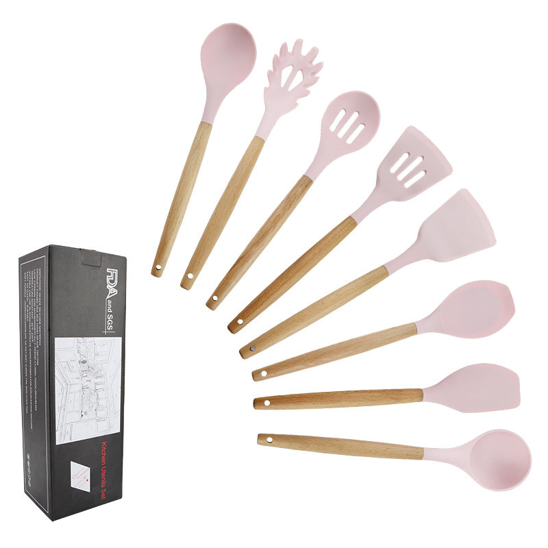 Pink wooden-handled silicone kitchen utensils