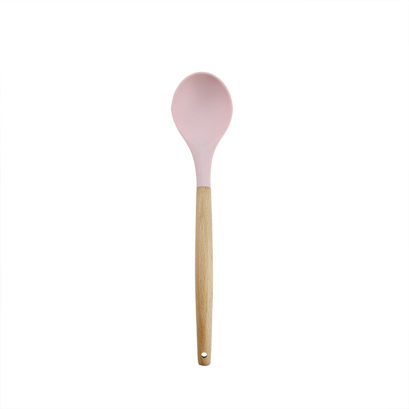 Pink wooden-handled silicone kitchen utensils